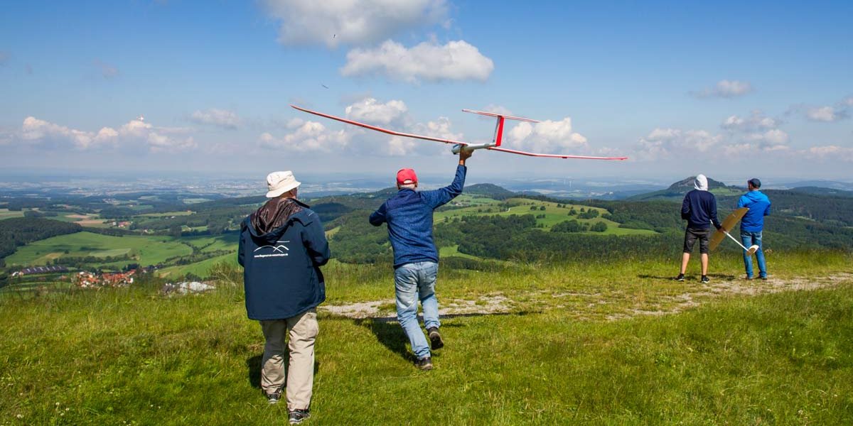Hand-launching a model glider on the Abtsrodaer Kuppe near the Wasserkuppe