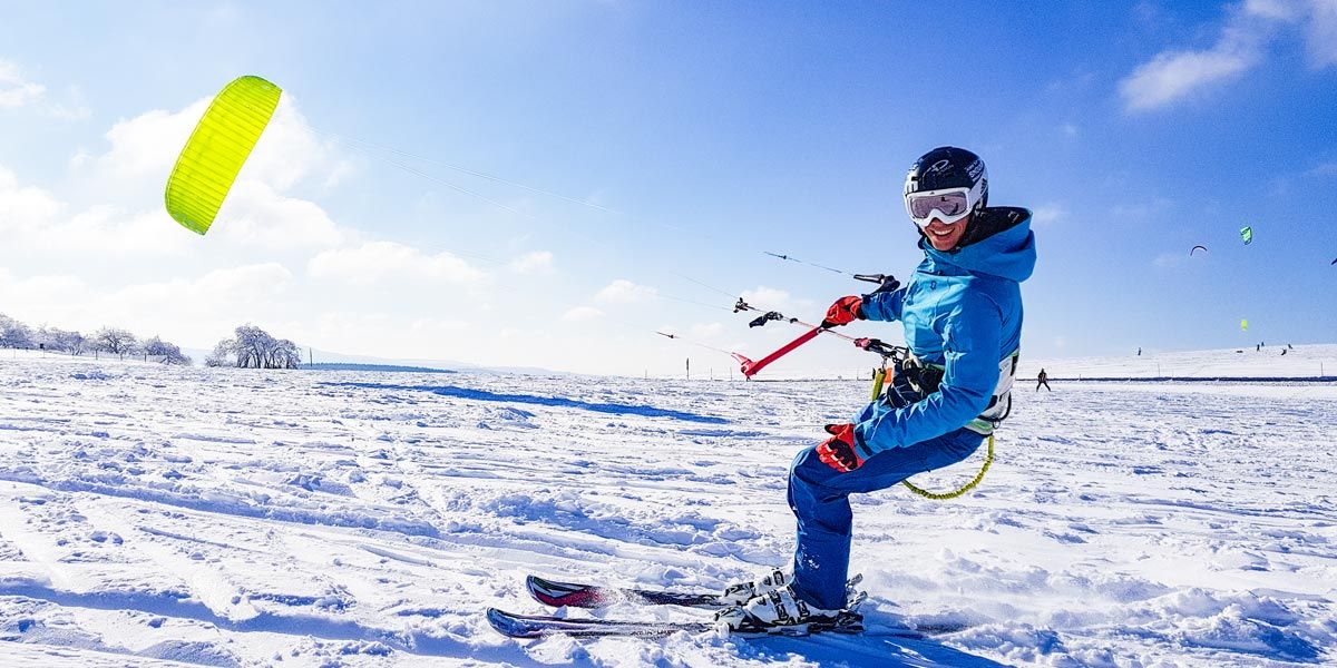 Snowkiter on the snow-covered plateau of the Wasserkuppe
